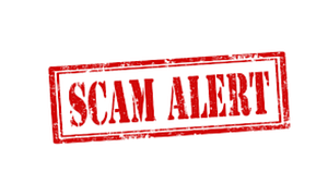 A red and white picture that reads scam alert