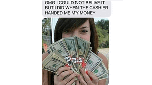 A picture of a white girl flashing money in front of her face