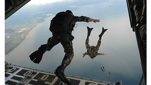a picture of a man jumping from an airplane