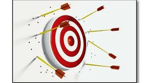 a picture of Wrong Target Audience, a red and white target board with darts around it